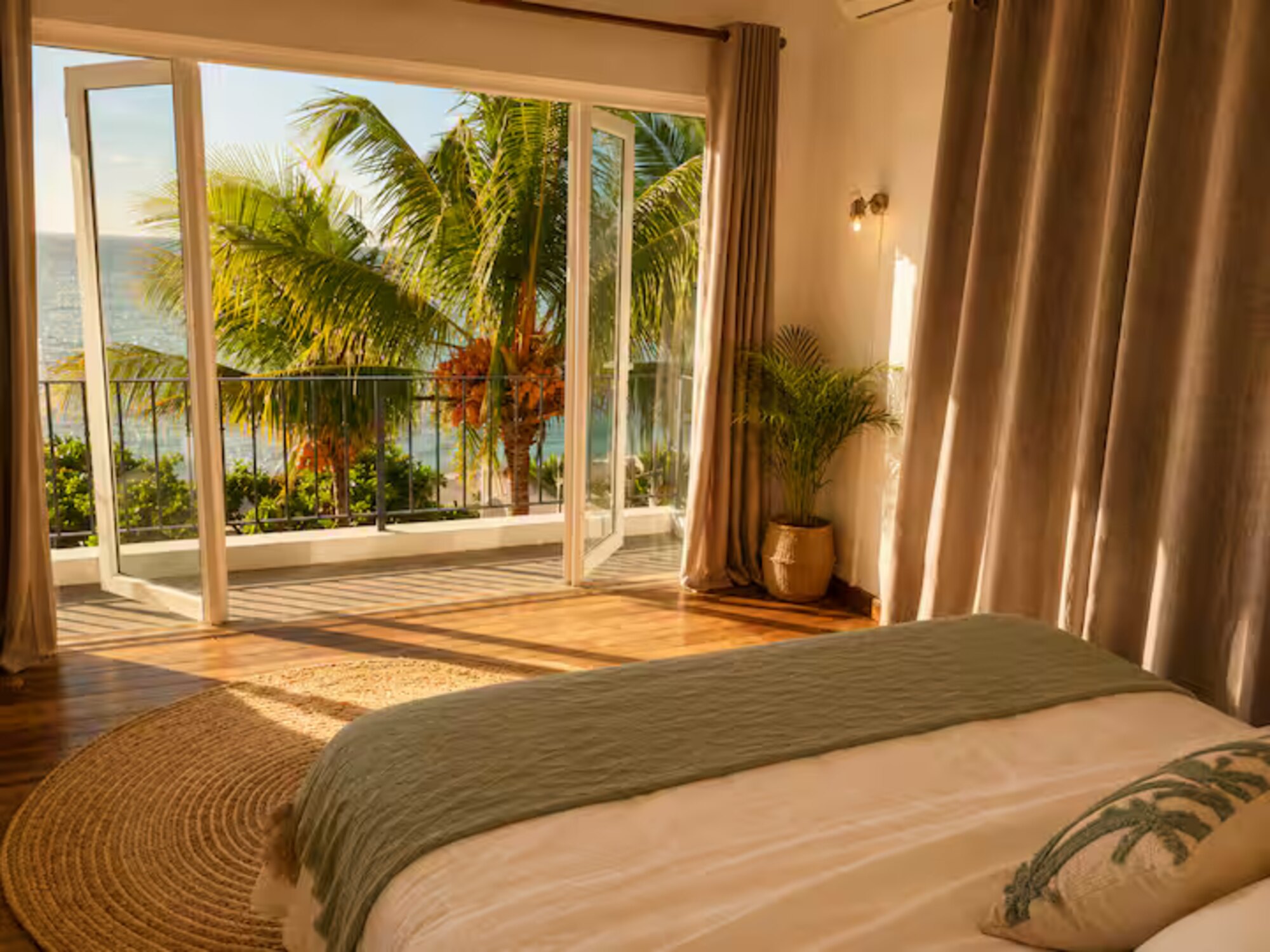 A peaceful bedroom at Lakaz Badamier, filled with natural light